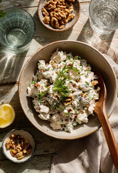 Gordon Ramsay chicken salad with walnuts lemon and fresh herbs in a bowl