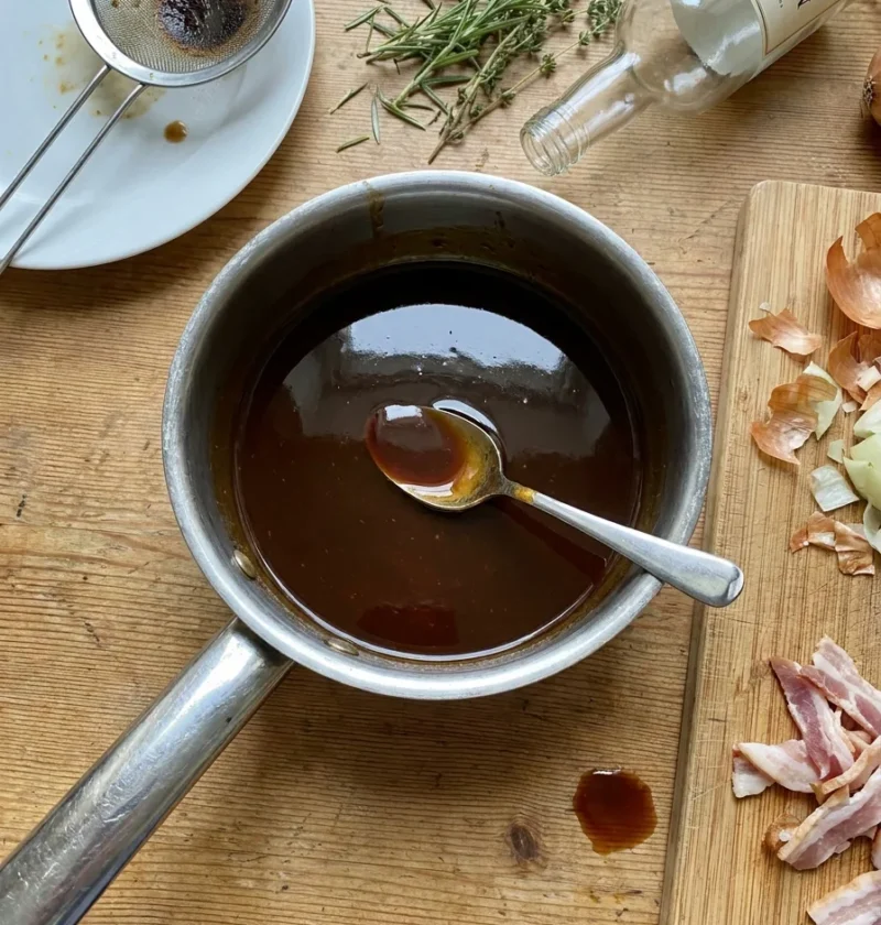Gordon Ramsay Madeira sauce in a saucepan with cooking mess