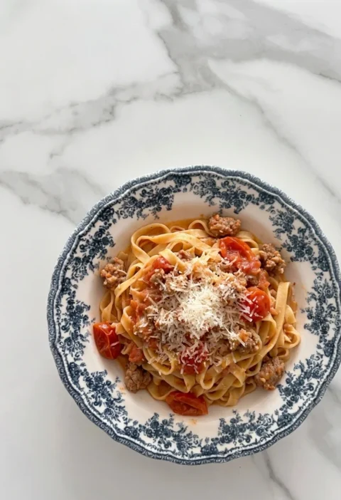 Gordon Ramsay sausage pasta with tagliatelle, crumbled Italian sausage and cherry tomatoes