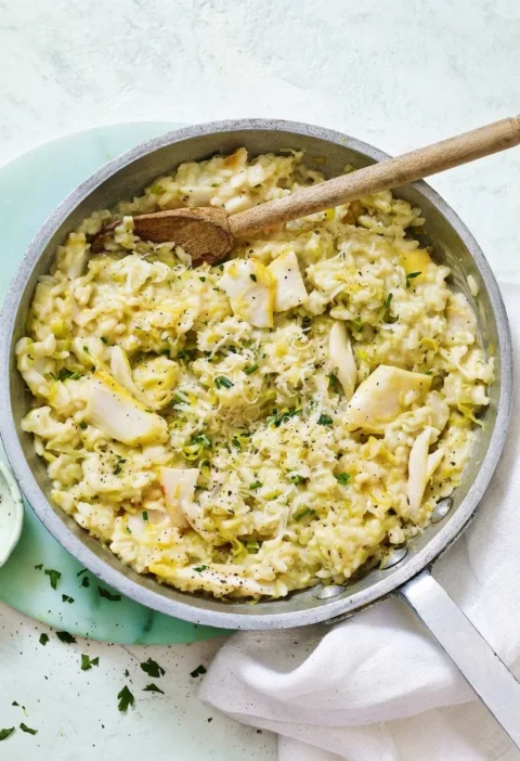 Gordon Ramsay smoked haddock risotto with leeks, chives and Parmesan in a pan