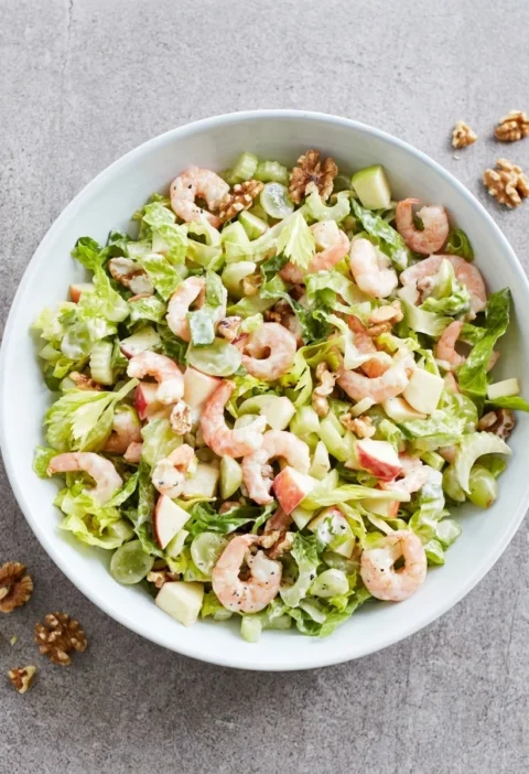 Prawn Waldorf salad with shredded romaine, green grapes, apple and toasted walnuts
