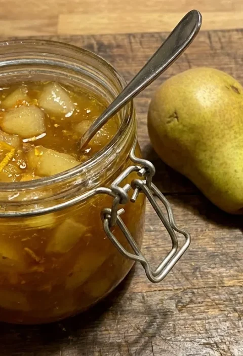 Gordon Ramsay pear and saffron chutney in a glass jar with chunky pear pieces and golden saffron colour