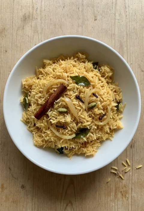 Gordon Ramsay pilau rice with saffron cinnamon cardamom and curry leaves in a white bowl