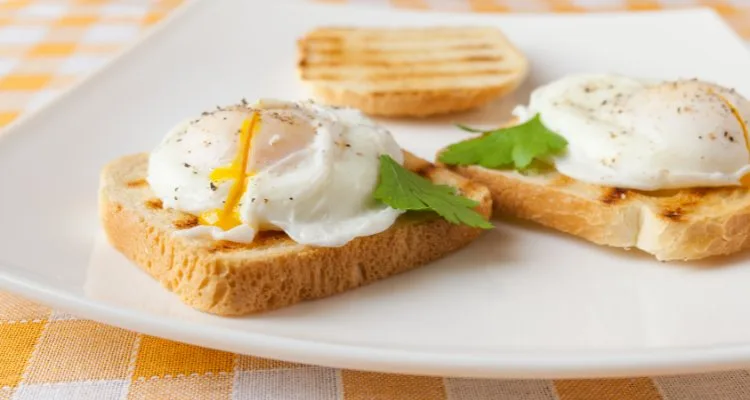 Gordon Ramsay poached eggs on toast with runny yolk and parsley