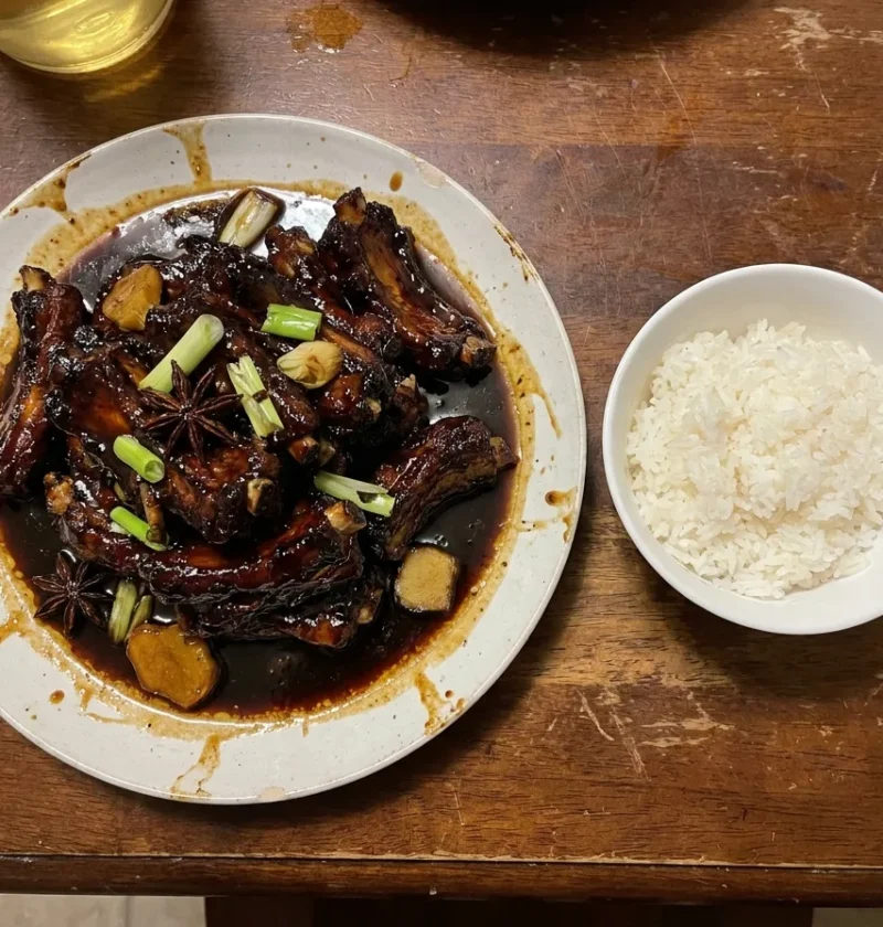 Gordon Ramsay sticky pork ribs with dark glossy soy and honey glaze, star anise and spring onions