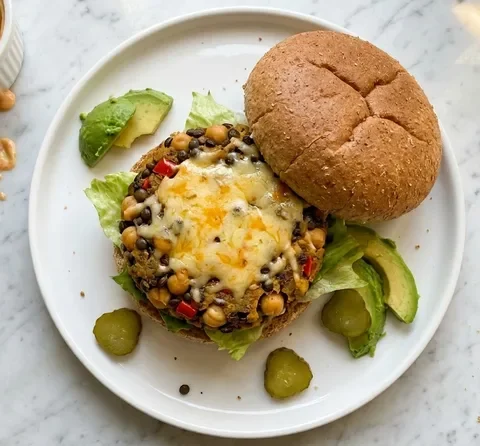 Gordon Ramsay veggie burger with chickpea and Puy lentil patty, melted Cheddar, avocado, gherkins and lettuce on a wholemeal bun with chipotle mayo