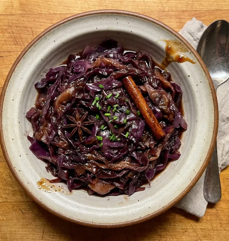 Gordon Ramsay braised red cabbage, glossy shredded cabbage in a syrupy port glaze with a cinnamon stick, star anise and chopped chives